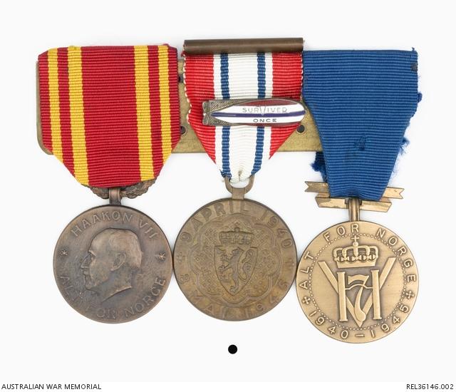 Aage Bergdahl’s medals with his “survived once” badge, acknowledging he survived a shipwreck due to enemy action, presented by the Norwegian Shipping and Trade Mission.