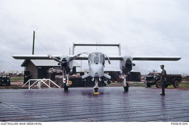 An OV-10 'Bronco' aircraft with one engine running on the tarmac at Di An, home of the US 2nd Brigade, 1st Infantry Division.