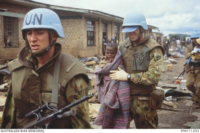 Australian troops assist the wounded at Kibeho, April 1995 (Photo George Gittoes)
