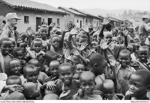 Members of the First Australian Services Contingent and friends in Busoro