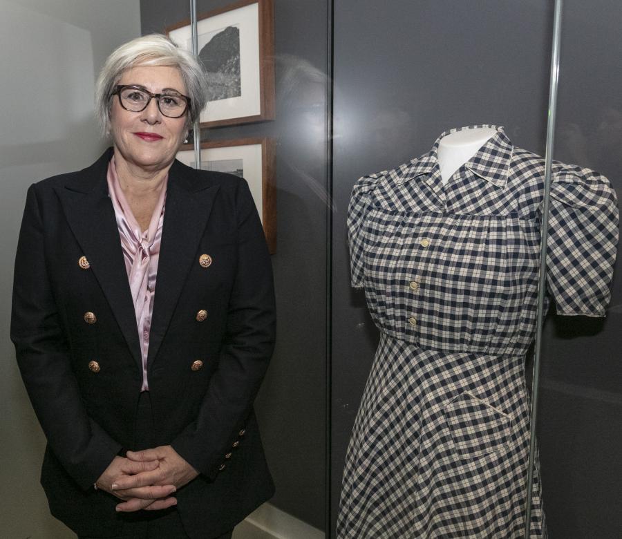 Naomi with her mother's dress at the Memorial