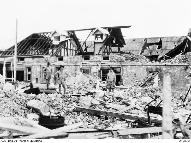 Darwin, NT. February 1942. Australian troops inspect bomb damage caused by Japanese air raids.
