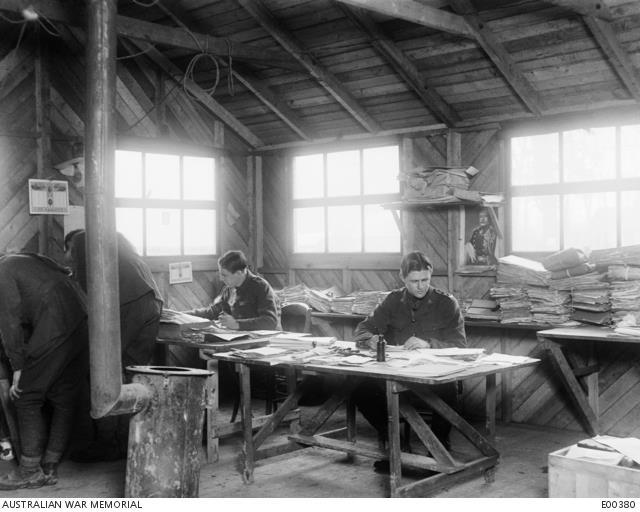 Lieutenant John Treloar (right) working at the Central Registry Office of the 1st Anzac Corps Headquarters, Henencourt, France, 1917. AWM E00380