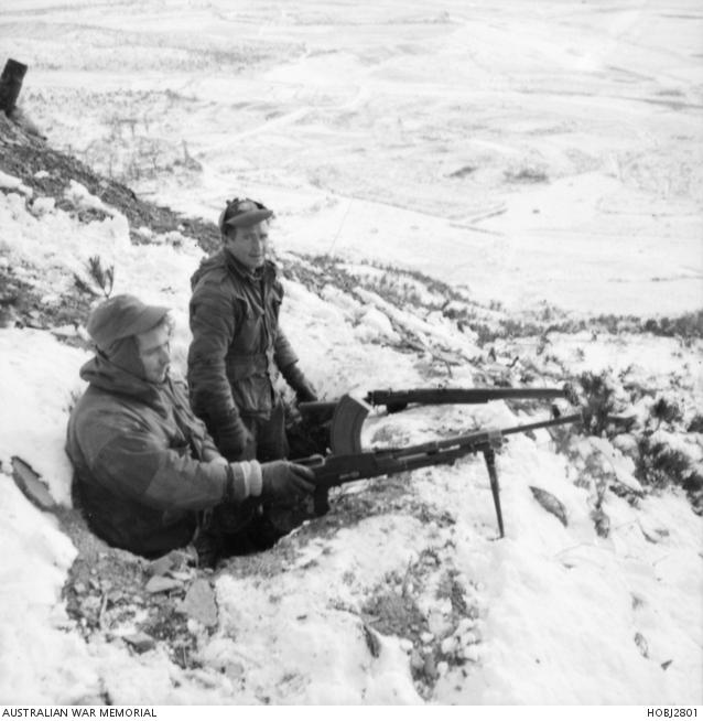 Korea, December 1951. Soldiers keep watch over a snow covered Korean valley.