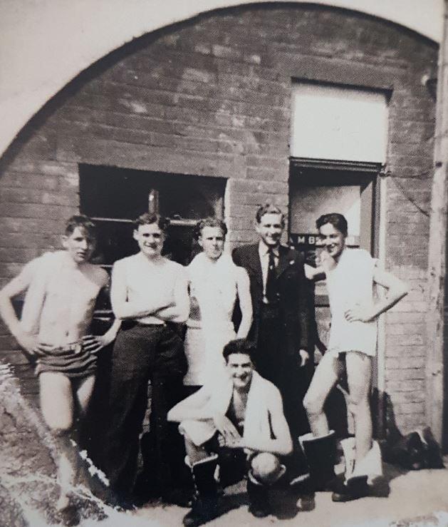 With the boys, just outside their Nissen Hut after a swim.