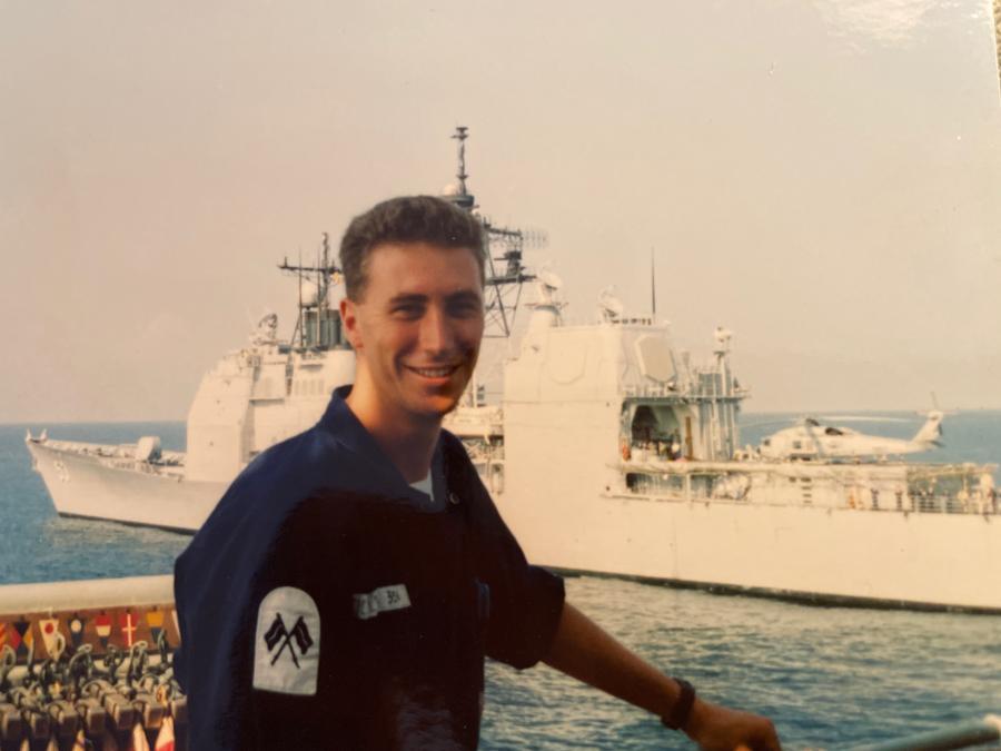 Jerry in the Persian Gulf with USS Mobile Bay in the background.