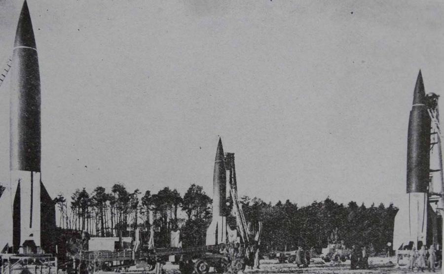 V-2 rockets being prepared for launch 1944 (left and right) placed over launching tables (centre) from a Meillerwagen.