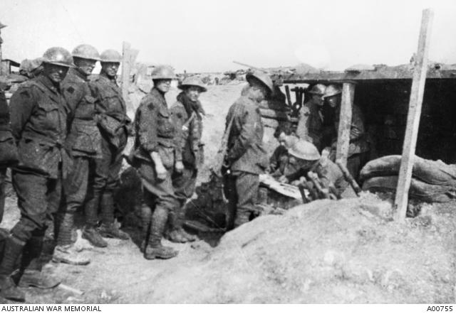 Soldiers from the 21st Battalion waiting their turn to vote in the Australian Commonwealth Government election. The 21st Battalion was in front line support trenches at the time at Vaulx-Vraucourt, in the Bullecourt sector. A00755