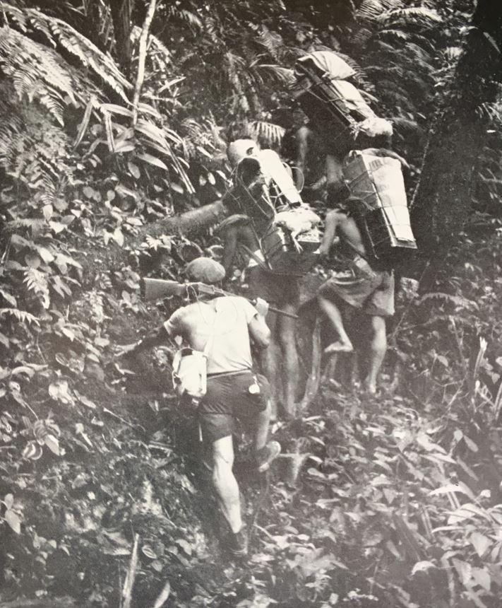 Climbing through Borneo's rugged jungled terrain. 