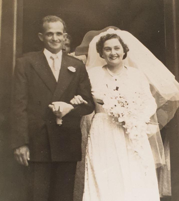 Russell with his wife on their wedding day.