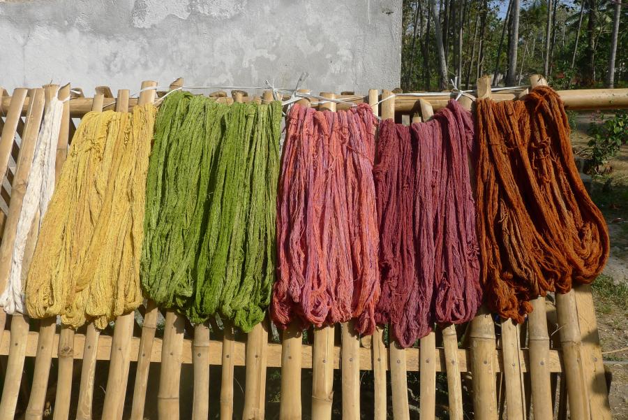 Organic dyed cotton hangs out to dry in the sun