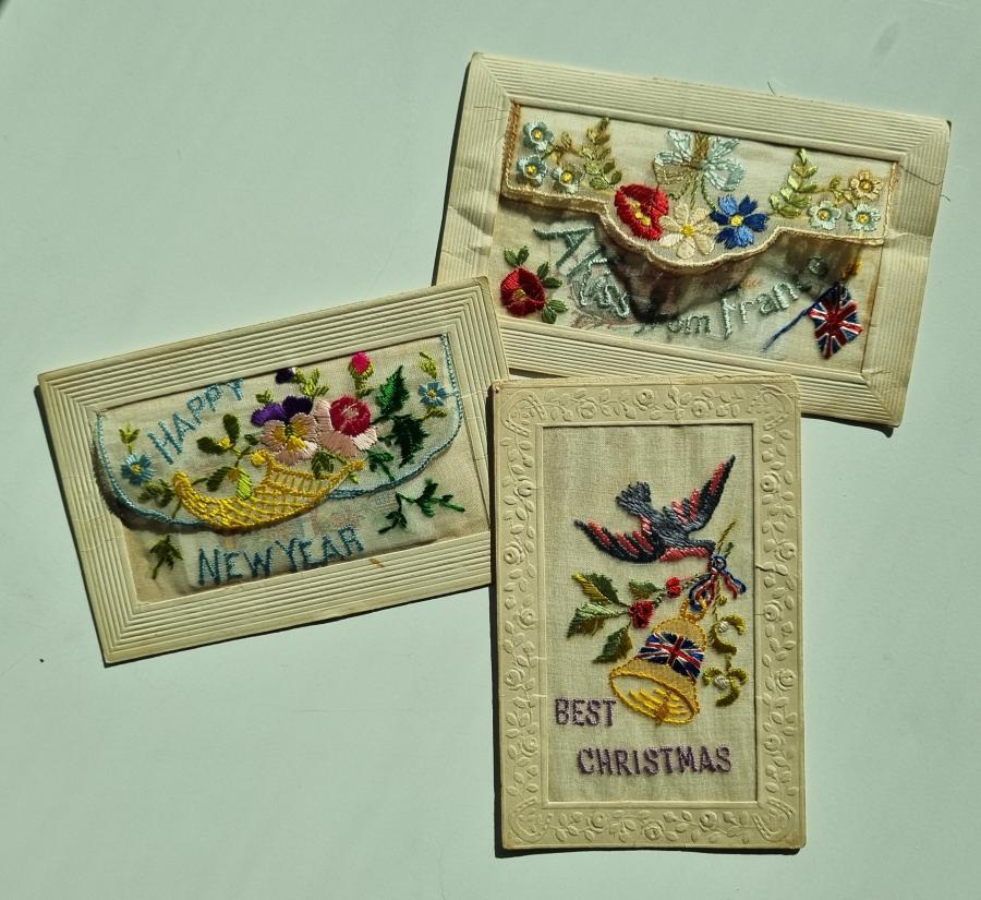 Three embroidered postcards