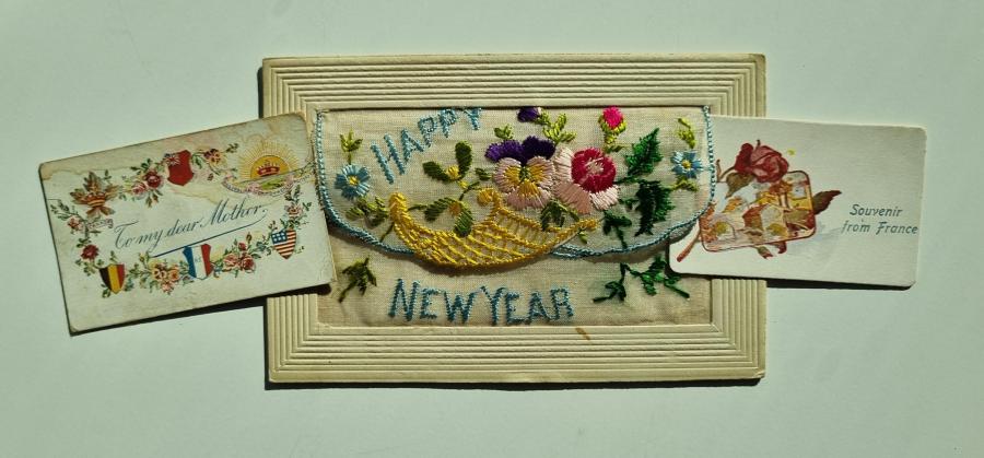 Front of embroidered postcard with "Happy New Year" writing
