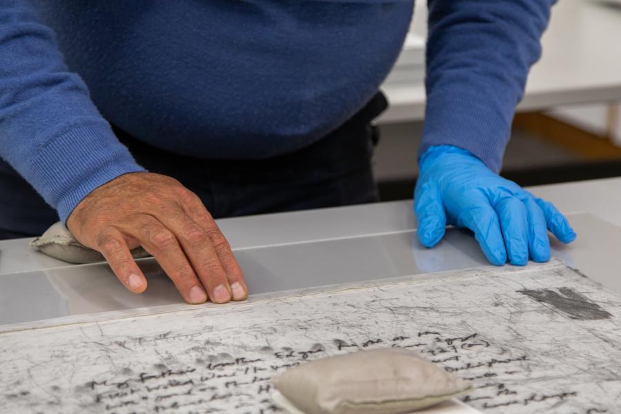 The work was attached to the first Perspex with the help of archival tape.  Photographer: Alix Heraid