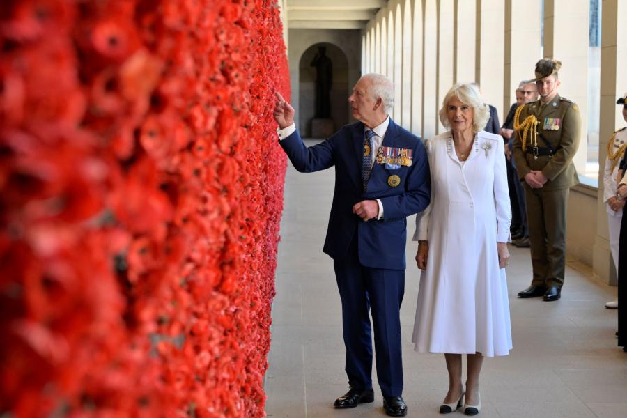 King Charles III and Queen Camilla paused to place poppies at the Roll of Honour when Their Majesties visited the Australian War Memorial on Monday 21 October 2024. Photo: David Whittaker, Australian War Memorial