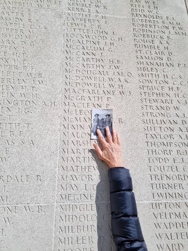 Donna visiting Peter's name on the Australian National Memorial at Villers-Bretonneux