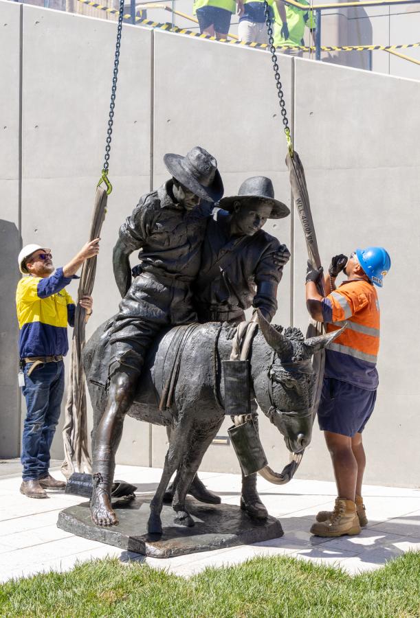 The Australian War Memorial's iconic Simpson and his donkey, 1915 sculpture was craned into position at the new Main Entrance on 13 December. Photo: Australian War Memorial.