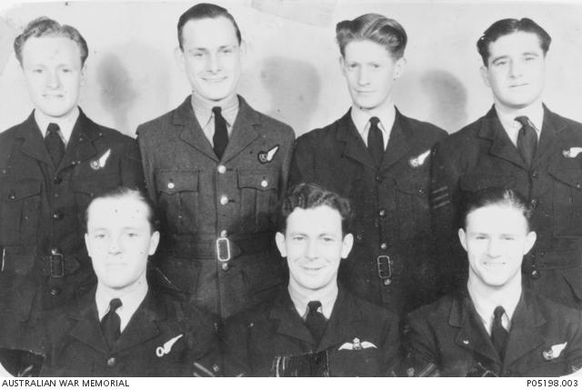 Group portrait of seven members of 467 Squadron RAAF including Flight Sergeant Verne Cockroft (back row, left).
