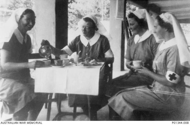 Matron Drummond pours tea for Vivian Bullwinkel at Johore Bahru hospital, Malaya, 