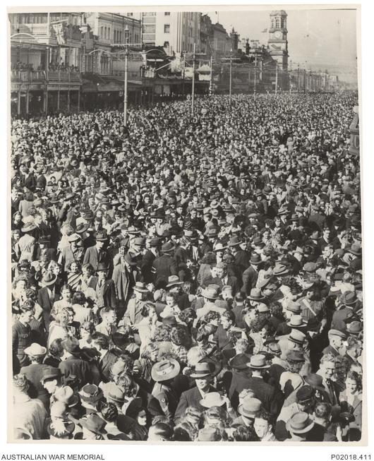 Solldiers and civilians celebrate VP Day on the streets of Adelaide, South Australia
