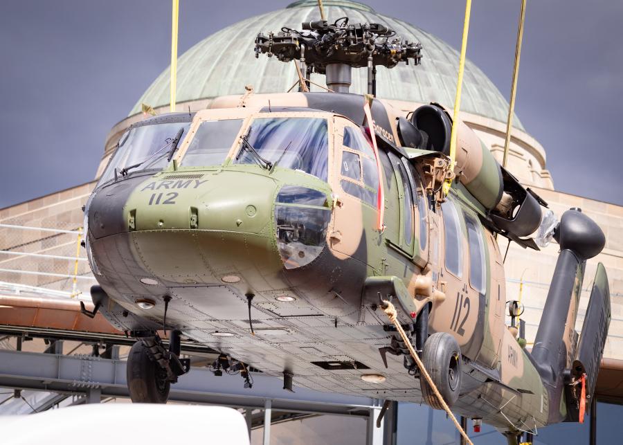 black hawk helicopter in front of the Australian War Memorial dome