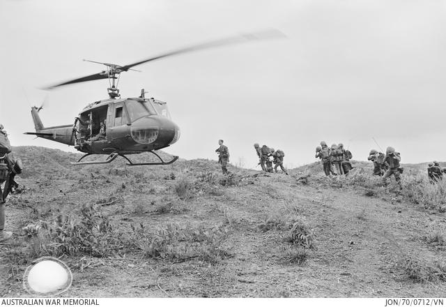 Vietnamese infantrymen, along with their two Australian advisors who are members of the Australian Army Training Team Vietnam (AATTV), board a US Army helicopter for a combat assault into enemy territory in the northernmost section of South Vietnam in September 1970.