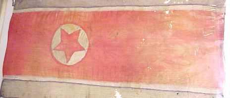 The North Korean flag features the red star 