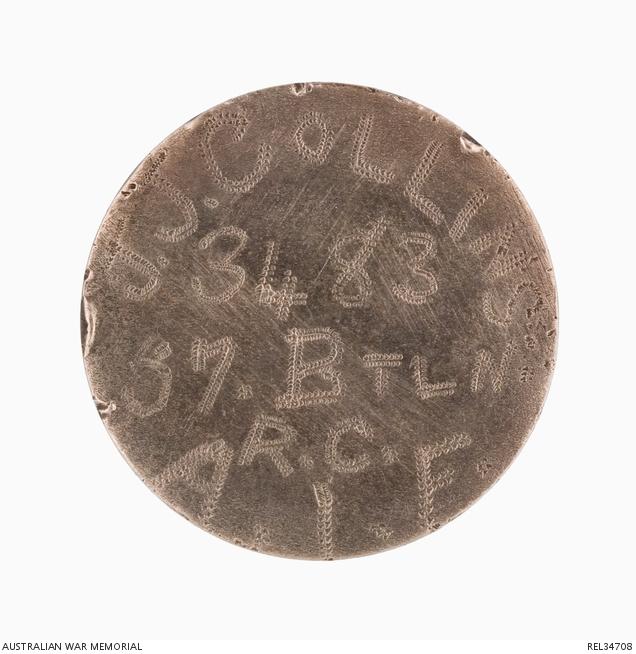 French coin worn as an identity disc by Joseph John Collins, with one side ground down and the soldier’s details engraved.
