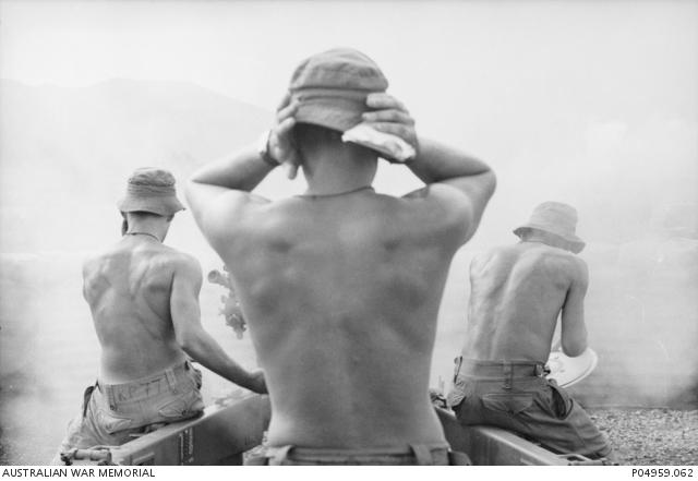 "Tim Page, 101 Field Battery, Royal Australian Artillery firing a 105 mm L5 pack howitzer, 1966 P04959.062"