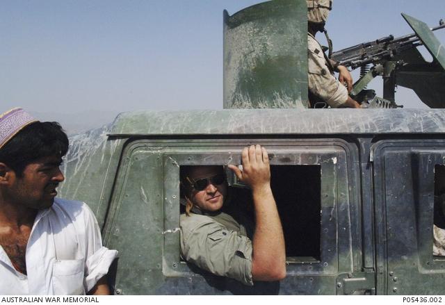 "Portrait of Stephen Dupont in Afghanistan by Sean Hobbs P05436.002"