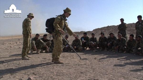 Australian Engineers of the Mentoring Task Force train Afghan National Army members in  the use of metal detectors to find IEDs
