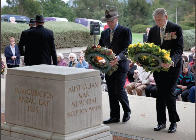a photograph of Then Minister for Veterans' Affairs the Honourable Warren Snowdon MP and Rear Admiral Ken Doolan (Retd) lay wreaths at the Anzac Aged Care Wreathlaying Ceremony 2013 held in the Western Courtyard of the Australian War Memorial