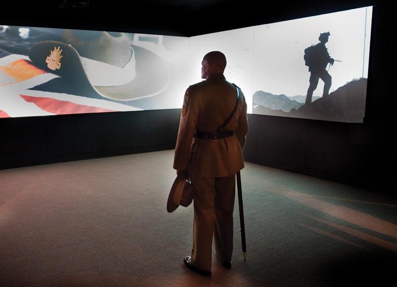 Warrant Officer David Ashley OAM, Regimental Sergeant Major, views the video display included in Afghanistan: the Australian story