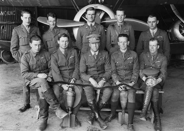 Officers of B Flight, No. 4 Squadron, AFC, at their aerodrome near Clairmarais in front of one of their Sopwith Camel aircraft.