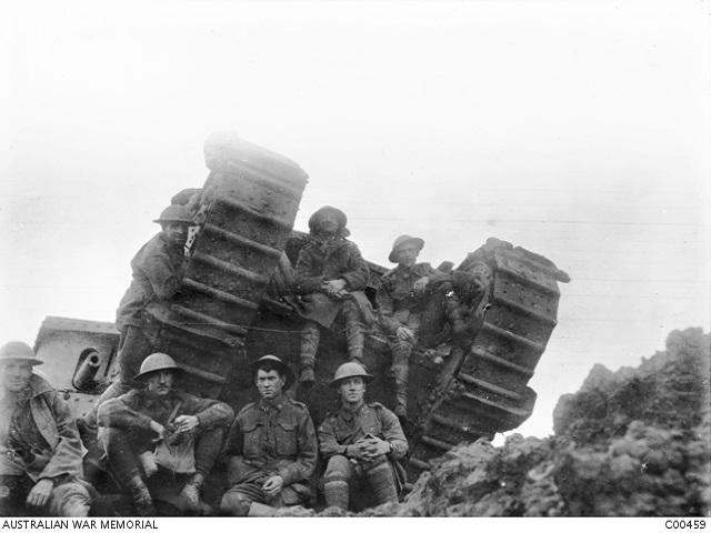 Soldiers with a British male Mark IV tank