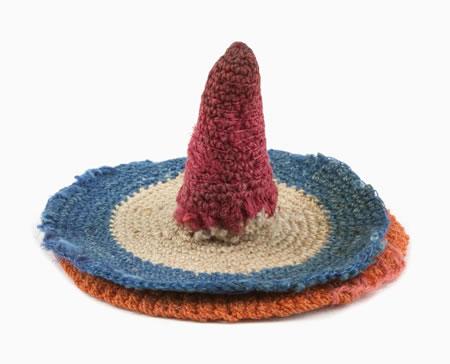 Crocheted in the red, white and blue colours of the Dutch flag, and the orange of the Netherlands’s royal house, this thimble-holder also held needles.