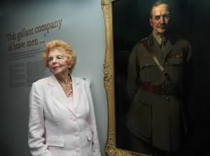 Mrs Valerie Howse OAM and the portrait of Major General Neville Reginald Howse VC KCB KCMG, the first Australian to be awarded the Victoria Cross in 1900
