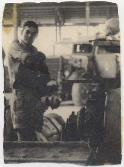 Corporal Doug Lewin in the No. 2 Construction Squadron workshop in Butterworth. Next to him is a D7 tractor, that he was repairing. (Photo courtesy of D Lewin.)