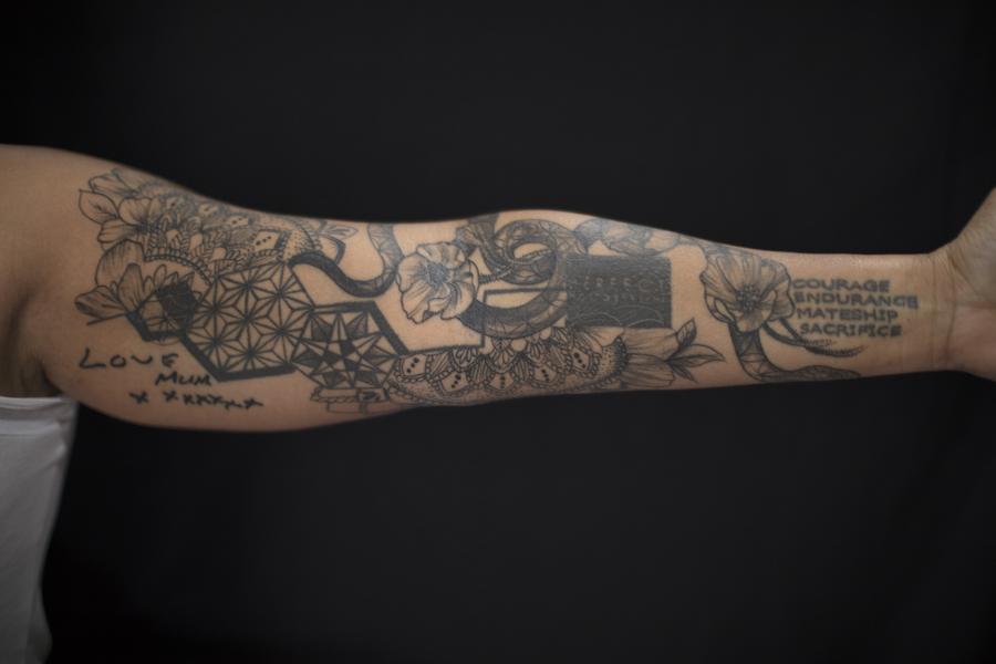 Elaine’s tattoos, although acquired at different times in her life, form a whole and coherent design. 