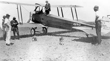 Hudson Fysh stands in an Avro 504K,