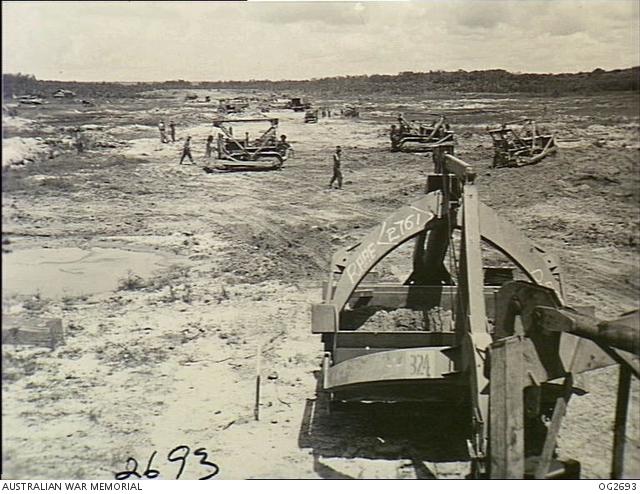 The No. 1 and No. 8 Airfield Construction Squadron, RAAF, were rushed to Tarakan for the vital job of servicing the bomb damaged strip for use by Allied aircraft.