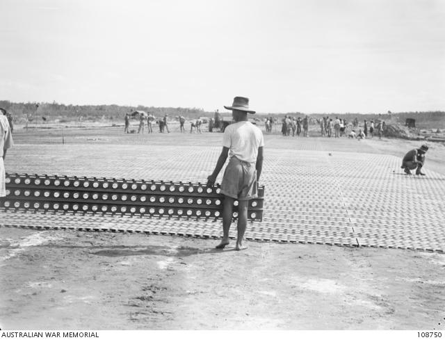 Laying of Marsden Mat during the rebuilding of the airstrip.