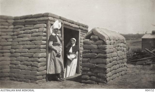 Wimereux, France. c. 1916. Two nursing sisters from No 2 Australian General Hospital at the entrance to the nurses' dugout.