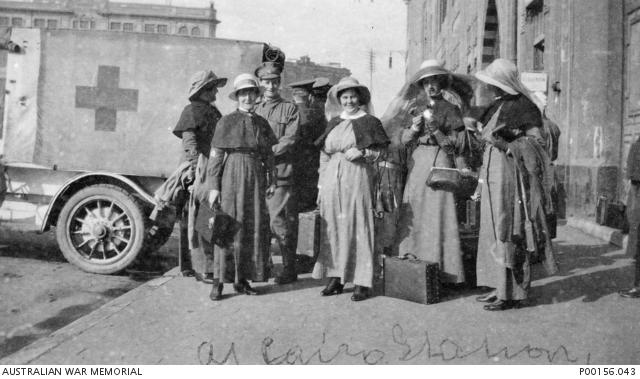 Nurses of the 2nd Australian General Hospital at the railway station in Cairo, Egypt, in 1916 waiting to leave for France.  