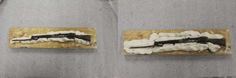 Initial stage of building thr moulding clay around the rifle