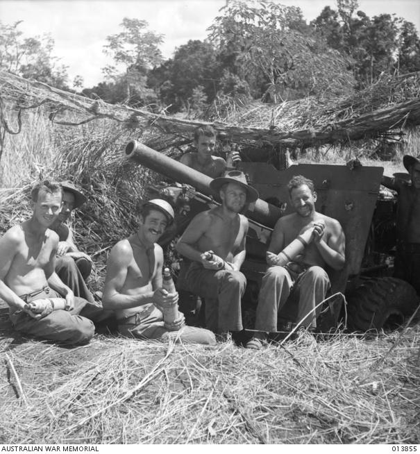 55/53rd infantry battalion crew of 25 pounder unit near the muzzle of their gun, 16th December, 1942. Photograph by George Silk. 