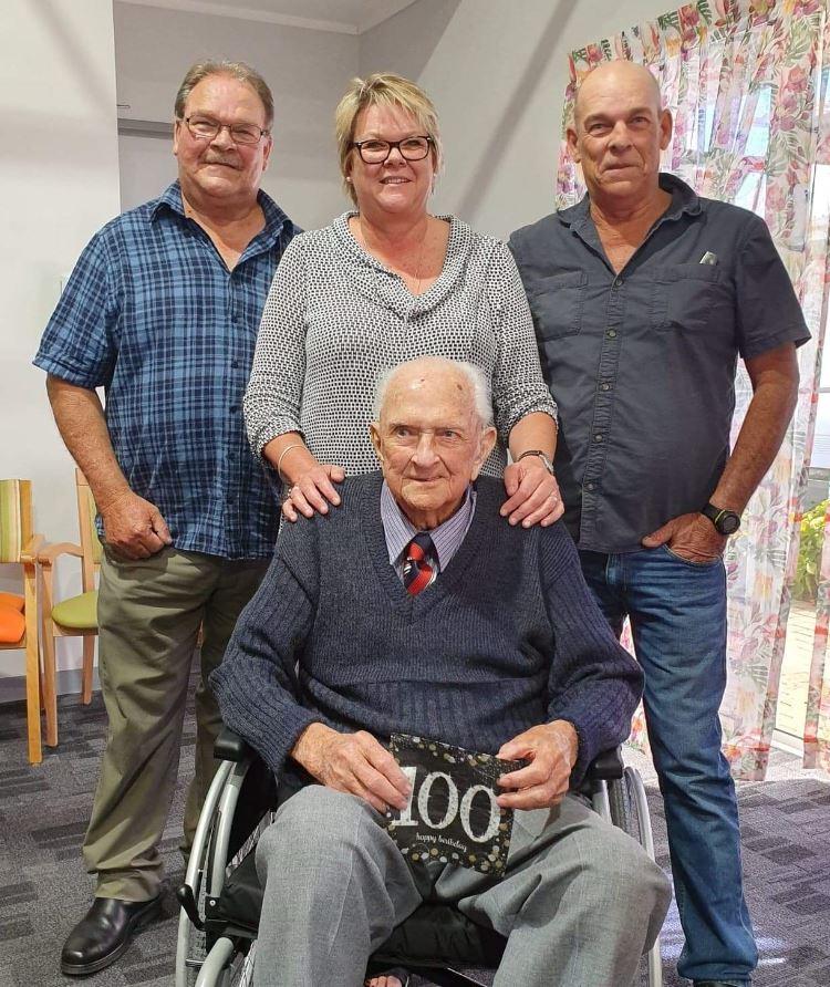 Ian celebrating his 100th birthday with his children