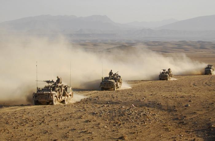 Special Operations Task Groups Long Range Patrol Vehicles drive in convoy across one of Afghanistan's desert, or 'dasht' regions.