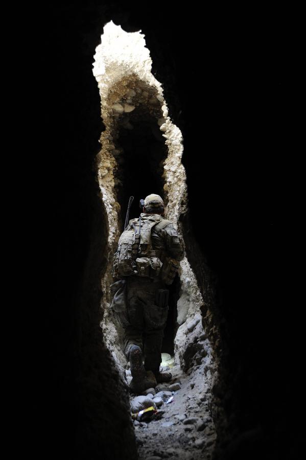 Soldier walking through a cave