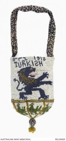 Beaded crochet purse featuring a lion rampant, the Mohammedan calendar year 1336, and the Gregorian calendar year of 1918.